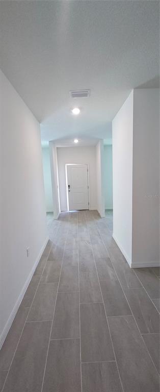 51 Kankakee Trail Palm Coast, FL 32164 - Photo 10 of 14 a view of an empty room with a window