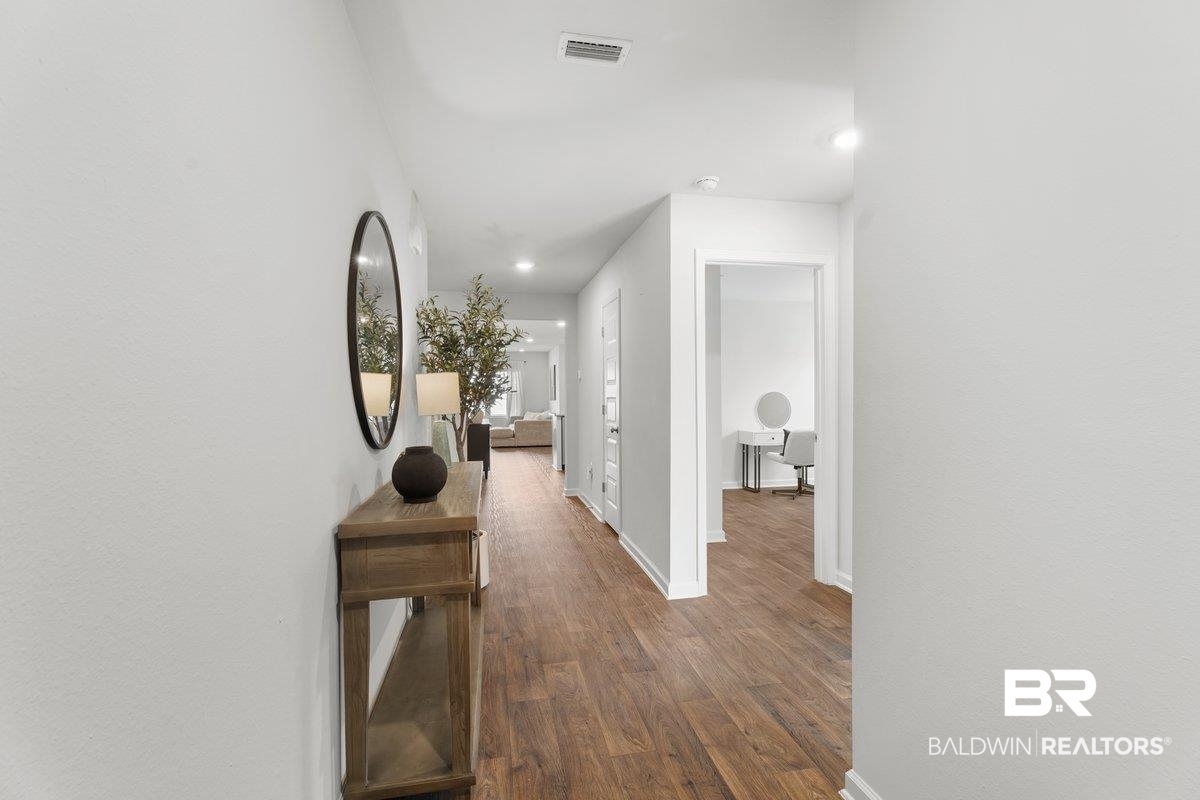 23641 Unbridled Loop Daphne, AL 36526 - Photo 5 of 40 Hallway featuring wood-finish flooring and recessed lighting
