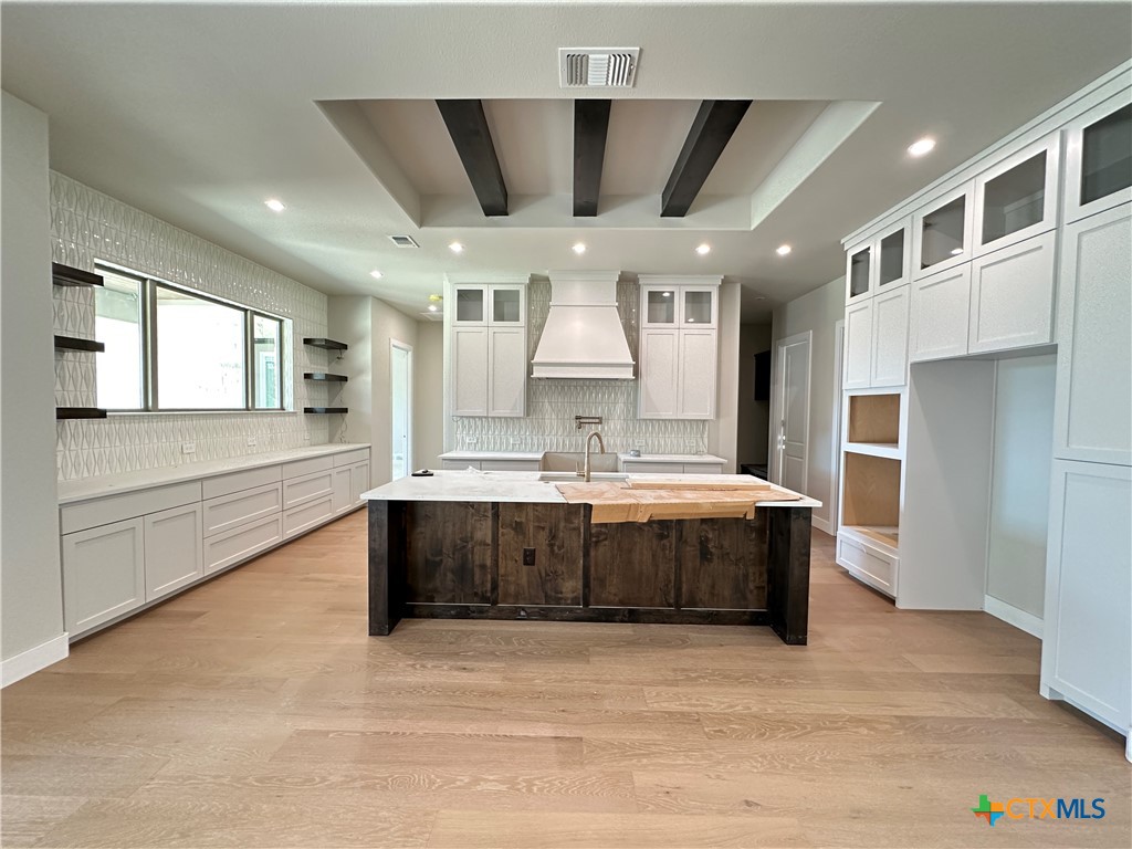 418 Dos Rios Drive Belton, TX 76513 - Photo 3 of 41 a large white kitchen with a large window