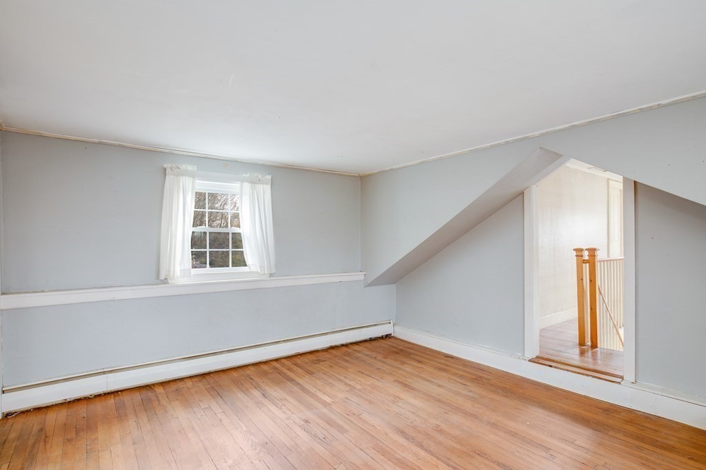 122 River Road Merrimac, MA 01860 - Photo 27 of 28 an empty room with wooden floor and windows