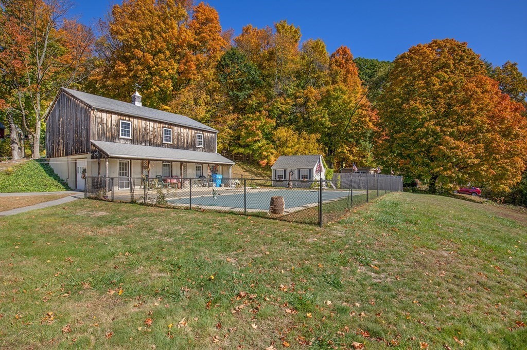 122 River Road Merrimac, MA 01860 - Photo 3 of 28 a view of a house with backyard and trees