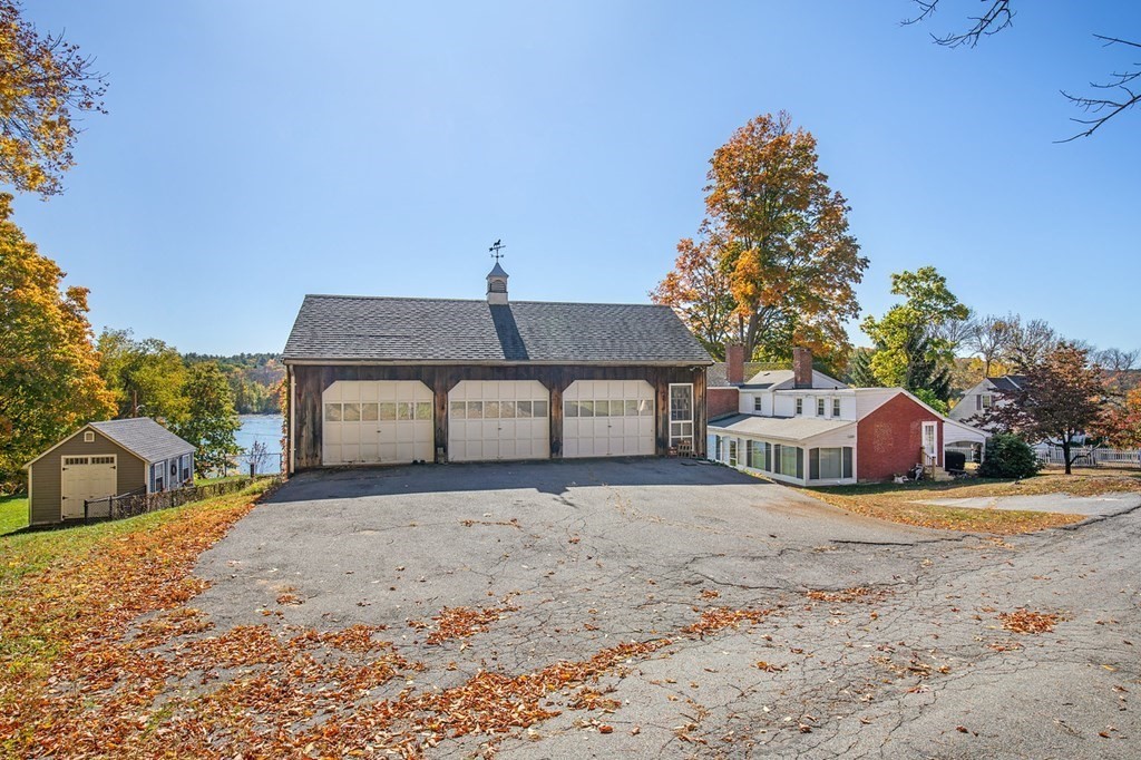 122 River Road Merrimac, MA 01860 - Photo 5 of 28 a front view of a house with a yard
