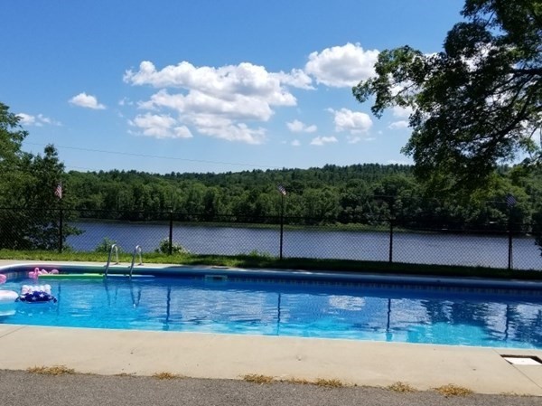 122 River Road Merrimac, MA 01860 - Photo 9 of 28 a view of a swimming pool with a yard
