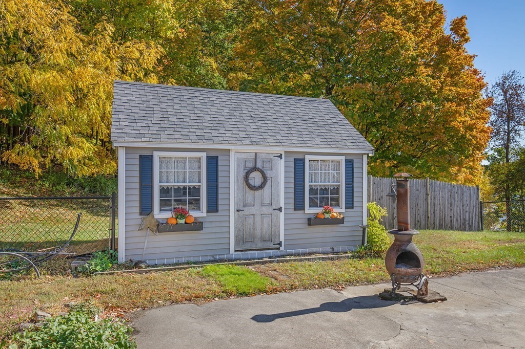 122 River Road Merrimac, MA 01860 - Photo 10 of 28 a view of a house with backyard and chairs