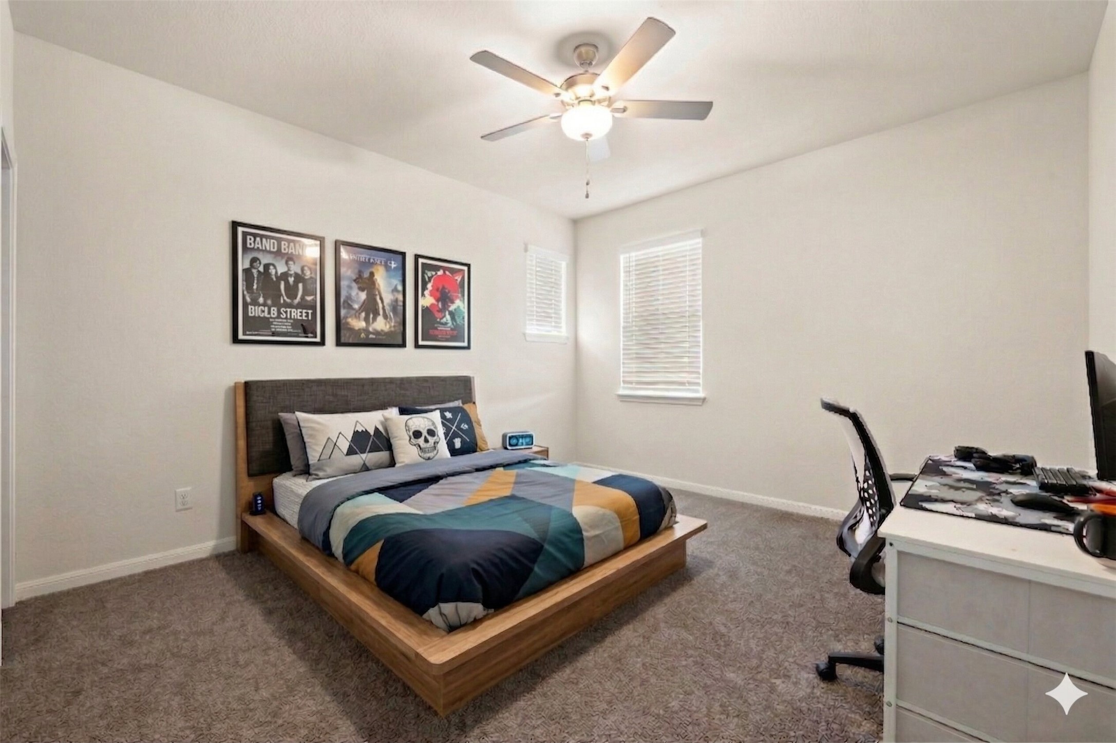 604 Spindrift Lane Leander, TX 78641 - Photo 16 of 32 Bedroom featuring a desk, dark carpet, and a ceiling fan