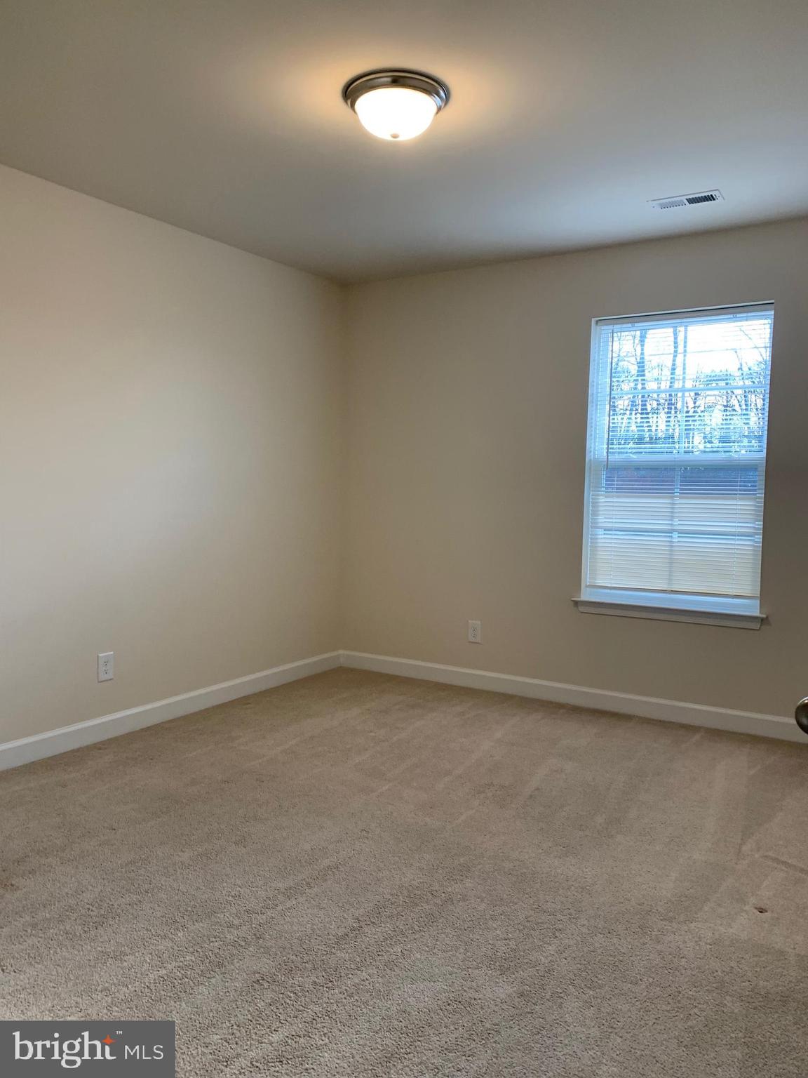 10312 Bluebird Court Spotsylvania, VA 22553 - Photo 18 of 20 an empty room with windows