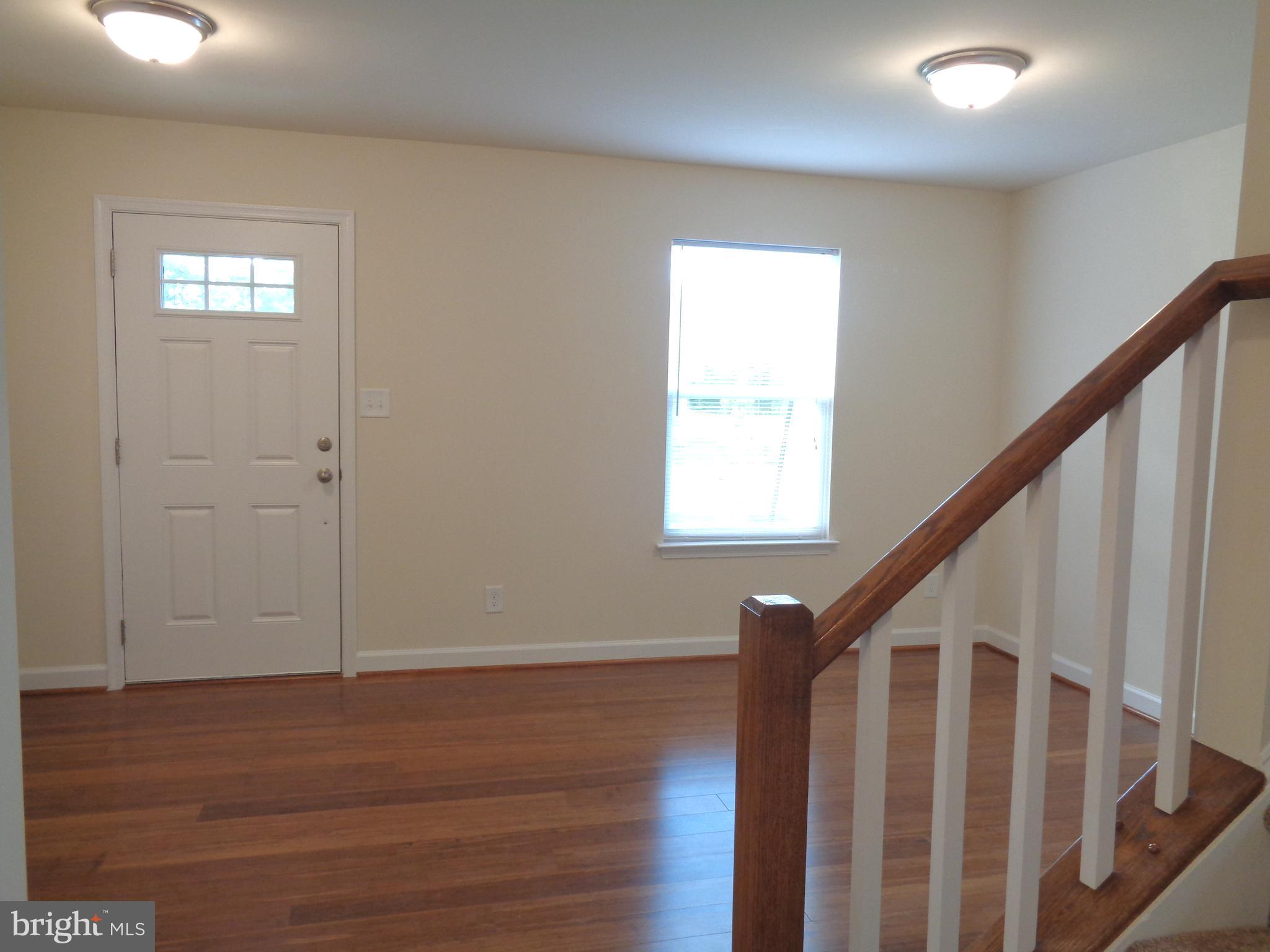 10312 Bluebird Court Spotsylvania, VA 22553 - Photo 3 of 20 a view of entryway with wooden floor