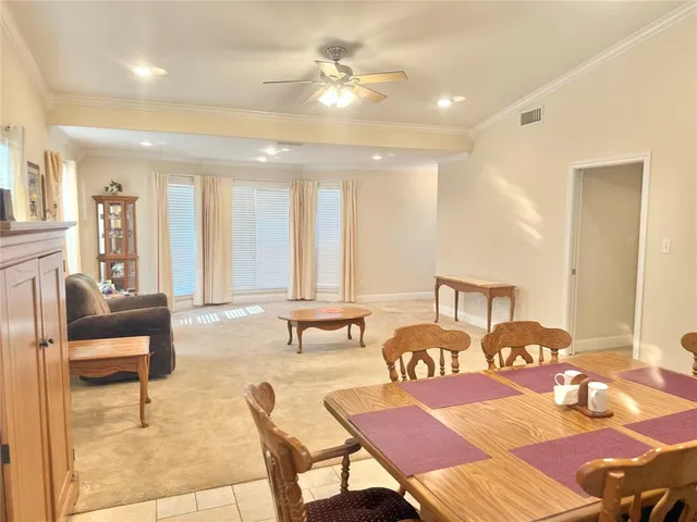 a bedroom with furniture and a chandelier