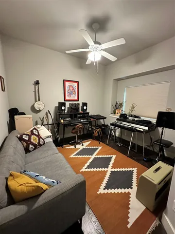 a kitchen with kitchen island granite countertop a sink a counter space and stainless steel appliances