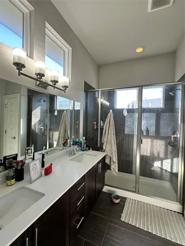 a bedroom with furniture and a large window