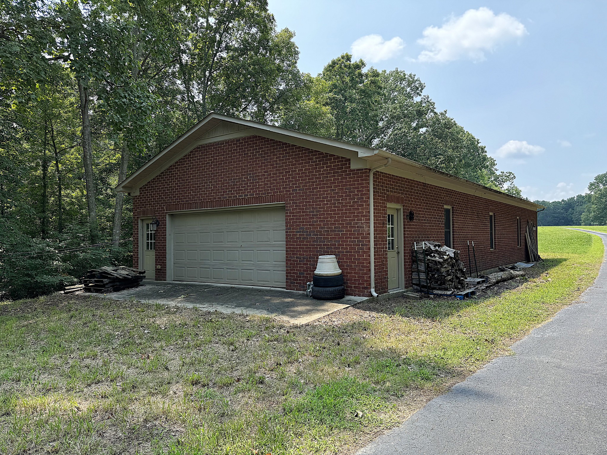 391 Fairview School Road Normandy, TN 37360 - Photo 3 of 68 a view of a house with yard and a large tree