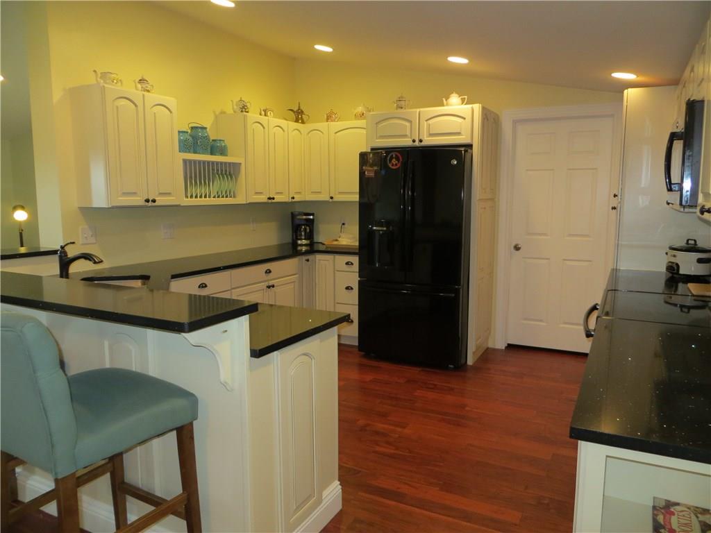 586 Anderson Hozak Road Clinton, PA 15026 - Photo 4 of 25 Recessed Lighting and Gleaming Acacia Hardwood Floors give a Warm Glow.