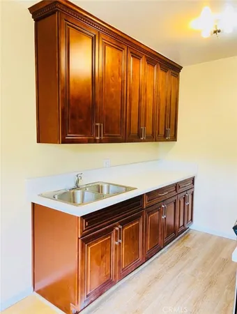 a kitchen with stainless steel appliances granite countertop wooden cabinets a sink and dishwasher