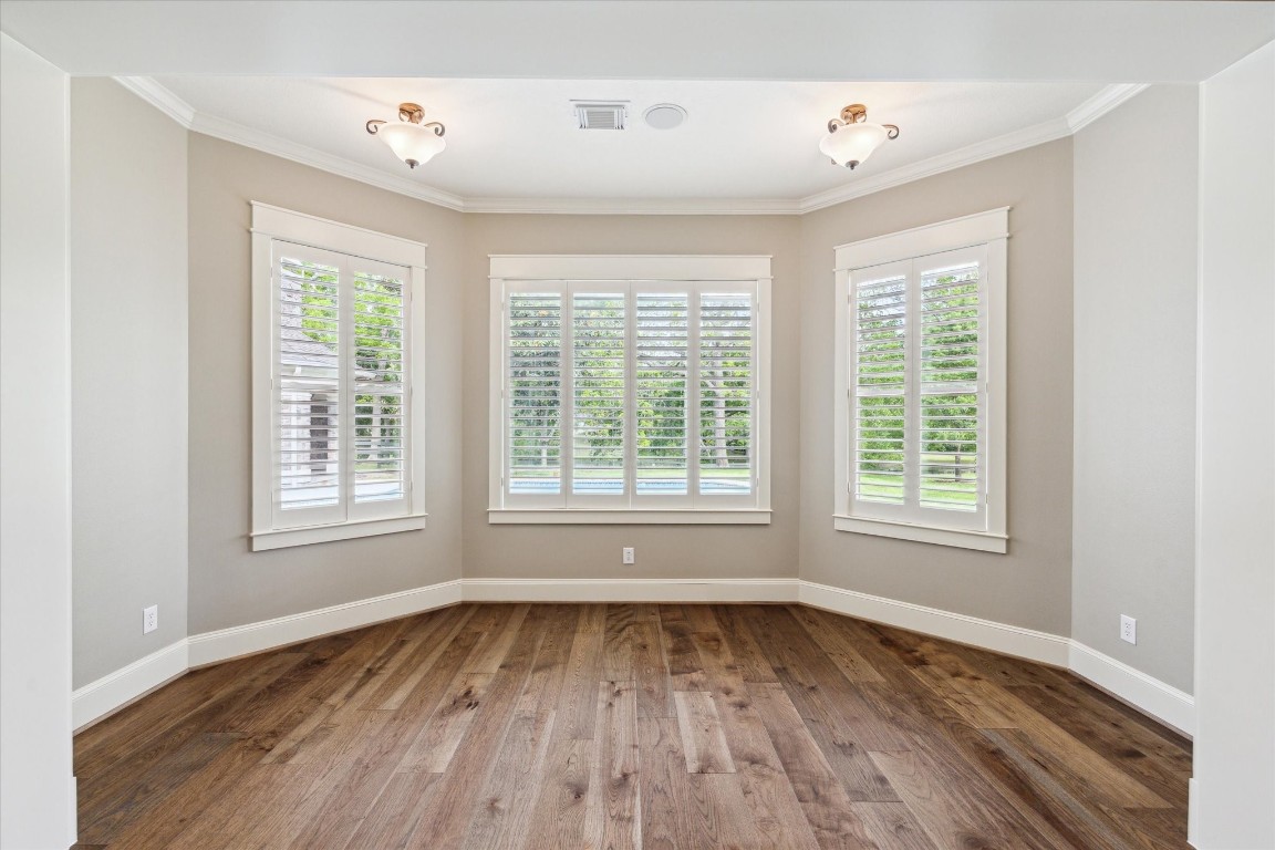 4511 Upper Oxbow Trace Fulshear, TX 77441 - Photo 14 of 40 a view of an empty room with wooden floor and a window