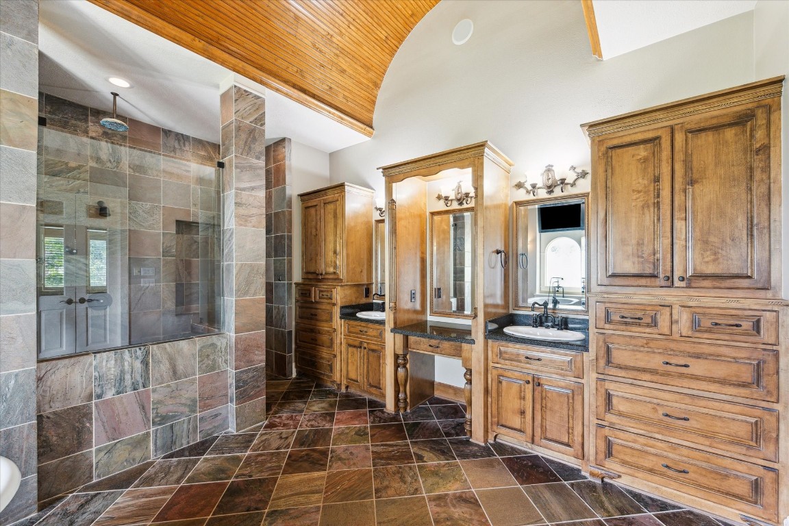 4511 Upper Oxbow Trace Fulshear, TX 77441 - Photo 15 of 40 a view of a bathroom with a shower and a sink