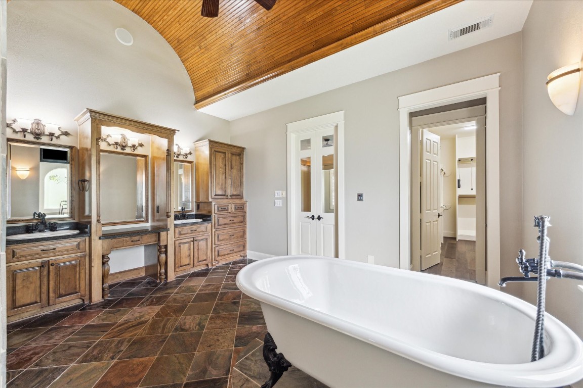 4511 Upper Oxbow Trace Fulshear, TX 77441 - Photo 16 of 40 a bathroom with a bathtub and a sink