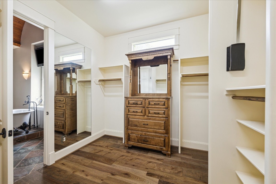 4511 Upper Oxbow Trace Fulshear, TX 77441 - Photo 17 of 40 a view of walk in closet with clothes and shoes