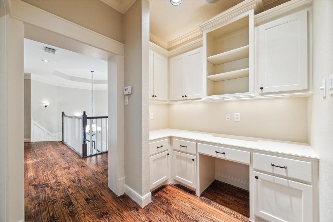 4511 Upper Oxbow Trace Fulshear, TX 77441 - Photo 24 of 40 a view of cabinets and wooden floor