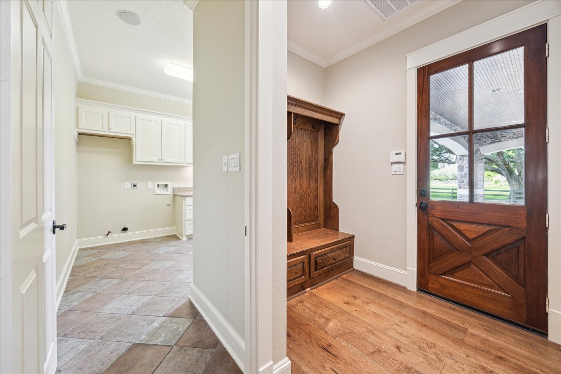 4511 Upper Oxbow Trace Fulshear, TX 77441 - Photo 25 of 40 a view of a hallway with wooden floor and closet