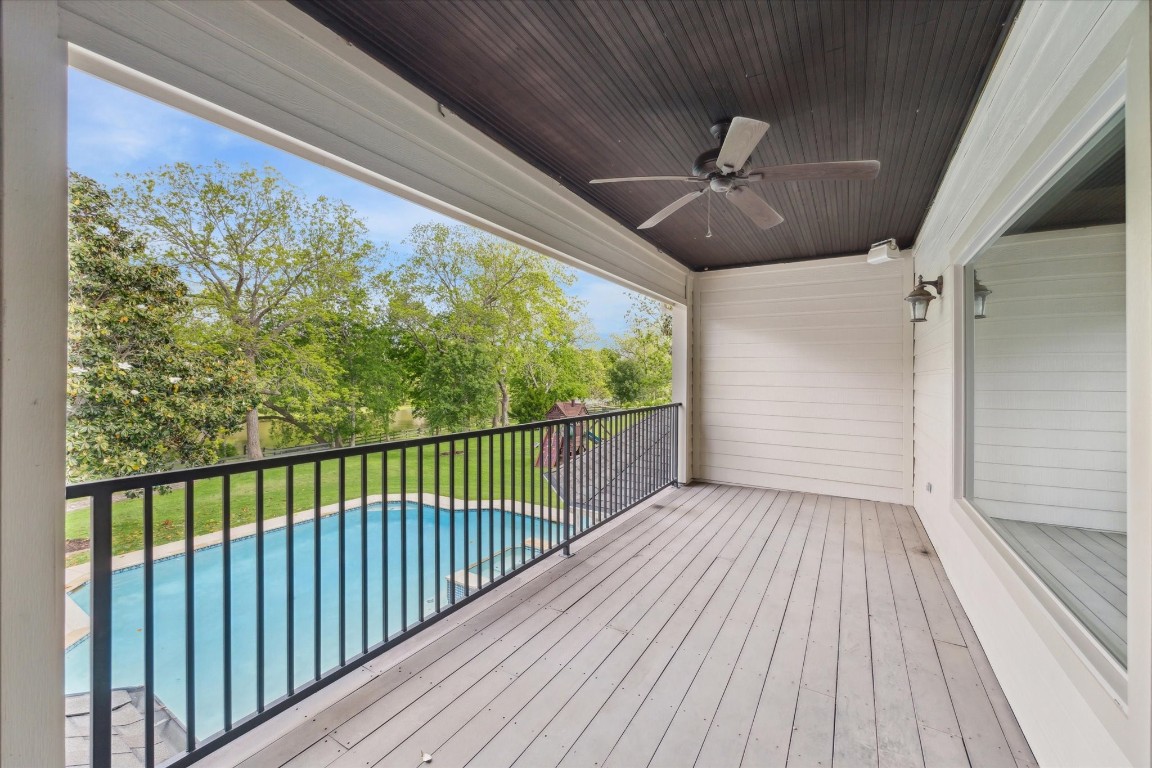 4511 Upper Oxbow Trace Fulshear, TX 77441 - Photo 35 of 40 a view of a balcony with wooden floor