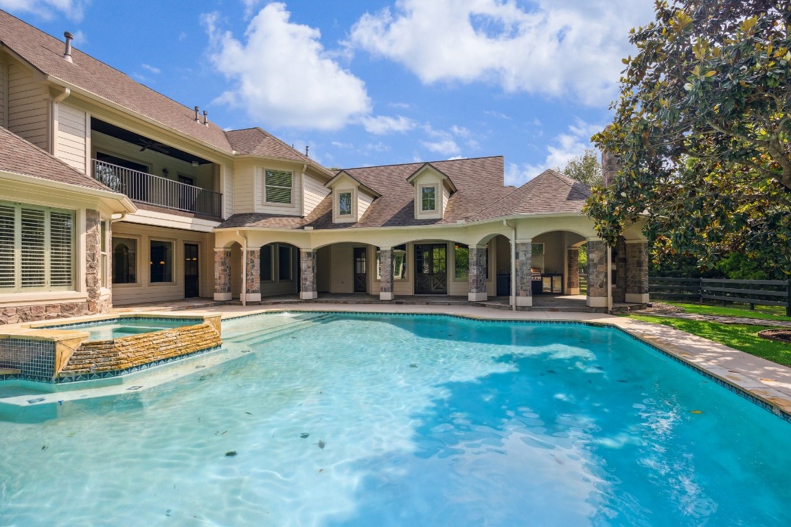 4511 Upper Oxbow Trace Fulshear, TX 77441 - Photo 36 of 40 a view of a house with swimming pool and a yard