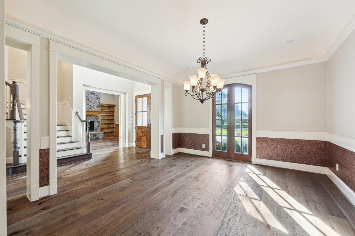 4511 Upper Oxbow Trace Fulshear, TX 77441 - Photo 5 of 40 a view of a livingroom with wooden floor and stairs