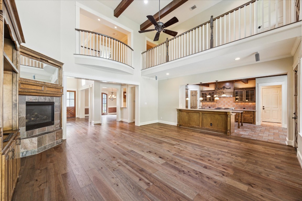 4511 Upper Oxbow Trace Fulshear, TX 77441 - Photo 8 of 40 a view of a living room kitchen with stainless steel appliances wooden floor and cabinets