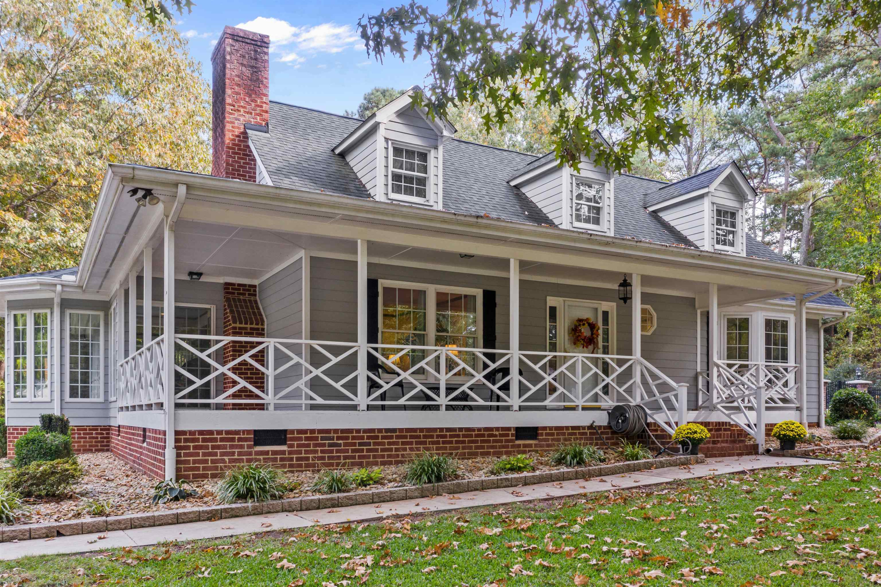 8417 Crowder Road Raleigh, NC 27603 - Photo 2 of 30 Beautiful wrap around front porch perfect for enjoying your morning coffee. Roof was done in 2016. Exterior Front