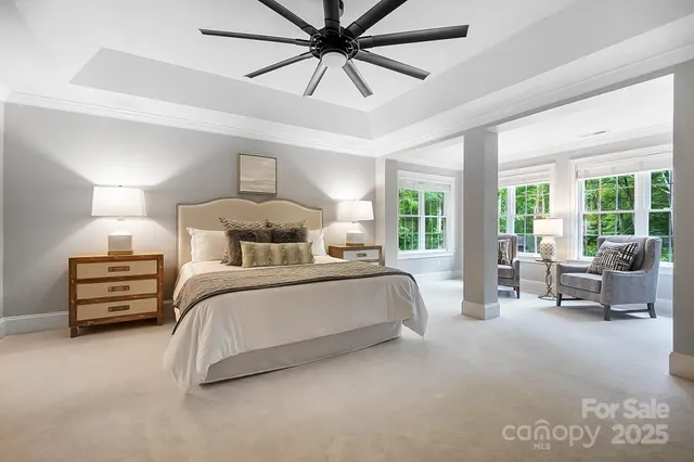 a front view of a house with yard and green space