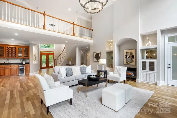 a living room with fireplace furniture and a rug