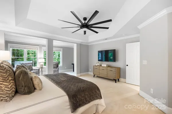 a bedroom with a bed and a couch