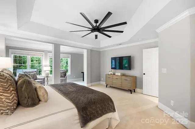 a front view of a house with a yard and trees