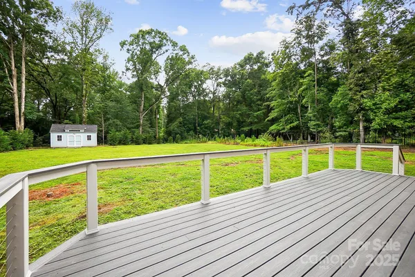 a view of a deck with a wooden fence