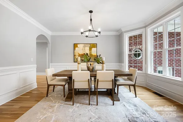a view of a dining room with furniture and window
