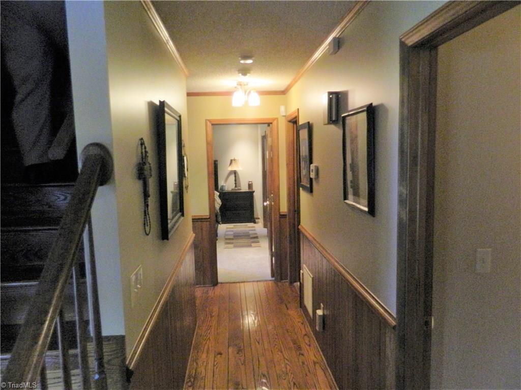 1729 Cheek Road Hamptonville, NC 27020 - Photo 8 of 17 Hallway leading to Master bedroom.