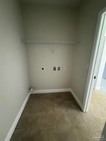 an empty room with a empty space and window