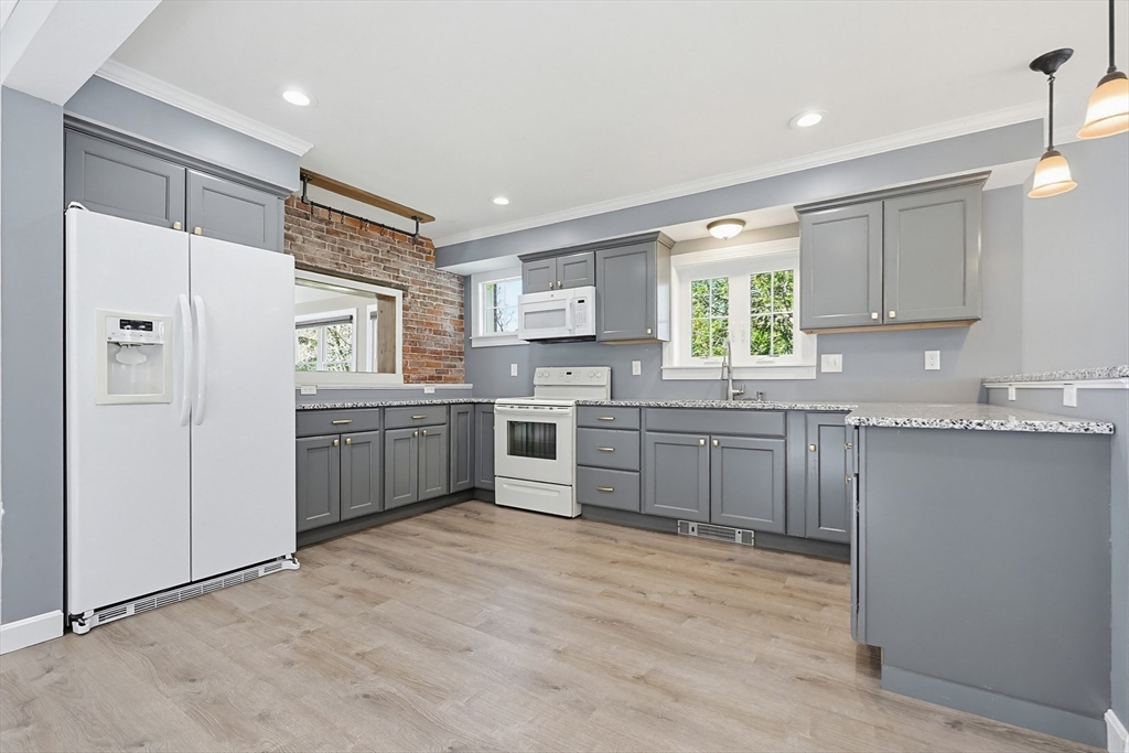 44 Clark Street Spencer, MA 01562 - Photo 12 of 41 a kitchen with a sink cabinets stainless steel appliances and window