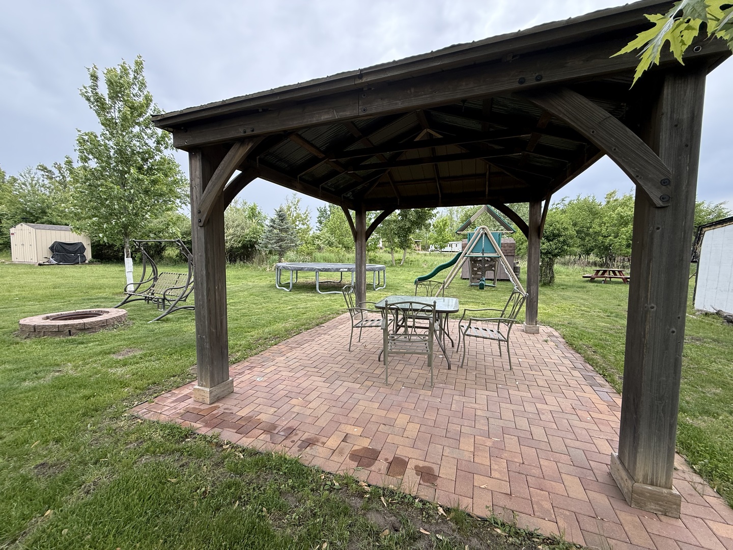 22-22 Woodhaven Lakes Sublette, IL 61367 - Photo 12 of 15 a view of backyard with green space and porch