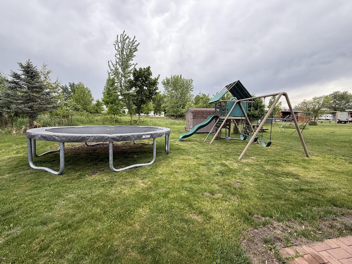 22-22 Woodhaven Lakes Sublette, IL 61367 - Photo 14 of 15 a view of a backyard with table and chairs