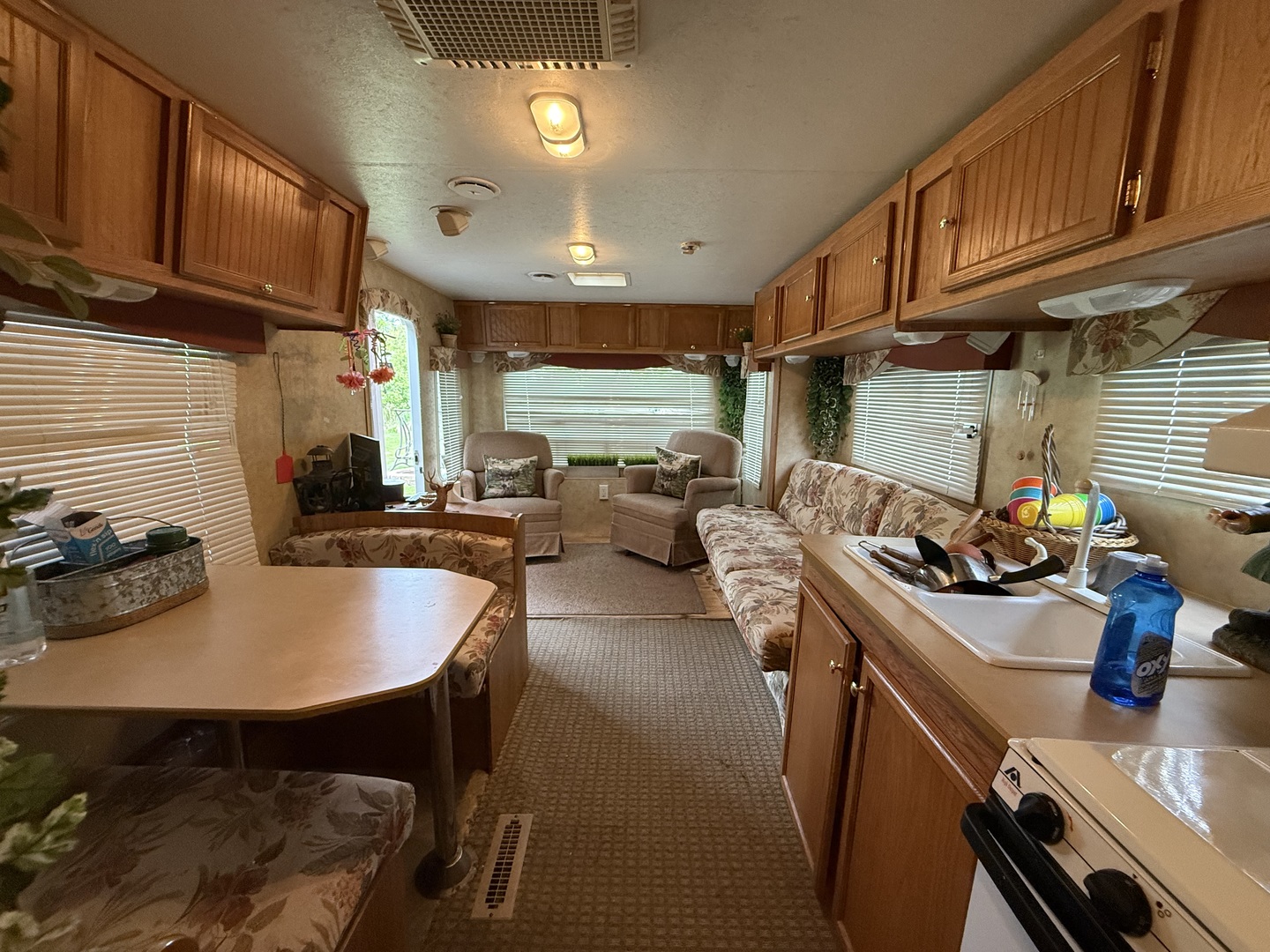 22-22 Woodhaven Lakes Sublette, IL 61367 - Photo 6 of 15 a kitchen with sink a stove and chairs