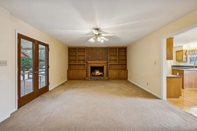 a kitchen with stainless steel appliances granite countertop a sink and a refrigerator
