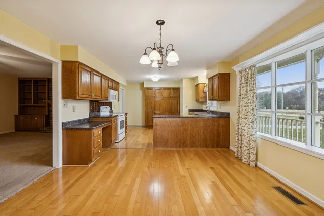 a en suite bathroom with a double vanity sink and mirror with shower