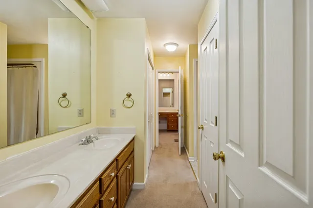 a view of empty room with ceiling fan