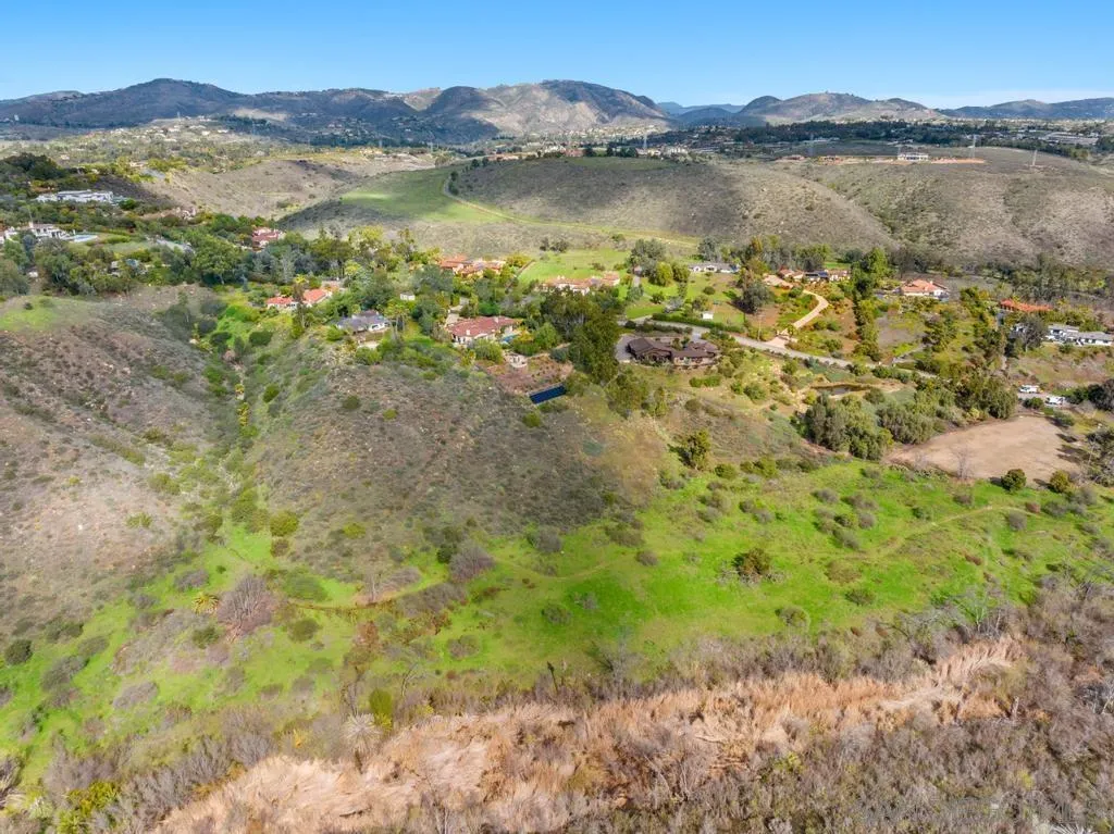 16574 Zumaque Rancho Santa Fe, CA 92067 - Photo 13 of 51 a view of a lake with mountains in the background