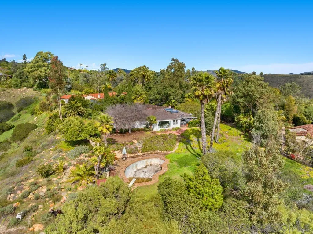 16574 Zumaque Rancho Santa Fe, CA 92067 - Photo 9 of 51 a view of houses with swimming pool and green space