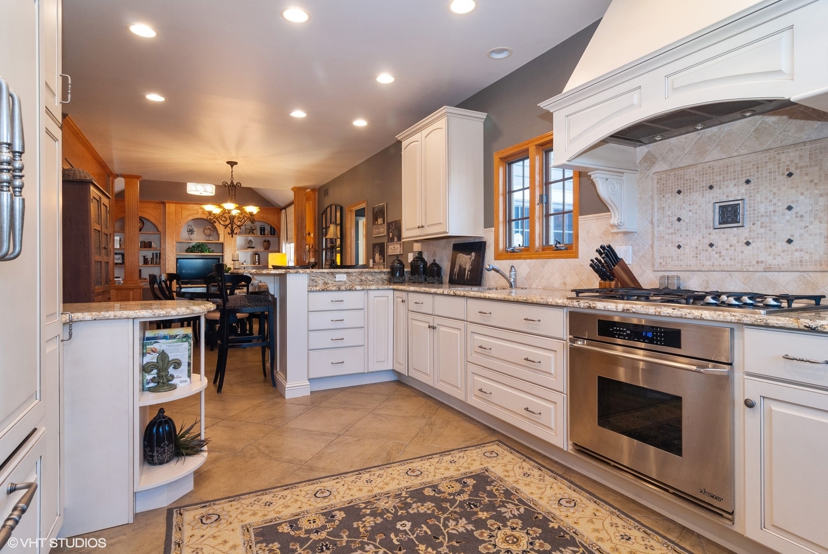 407 Hankes Road Sugar Grove, IL 60554 - Photo 10 of 40 a kitchen with stainless steel appliances kitchen island granite countertop a stove a sink and a refrigerator