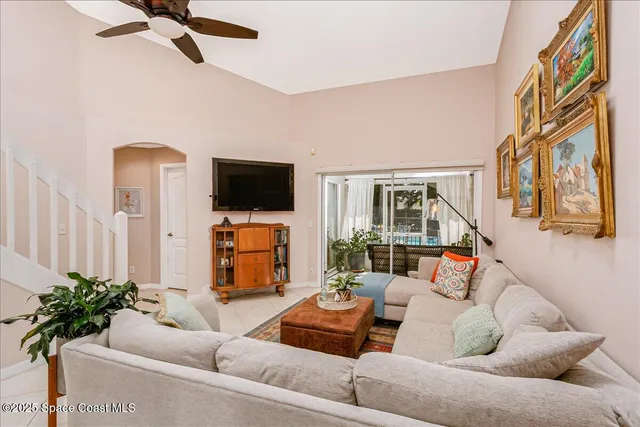 a view of a livingroom with furniture and a flat screen tv