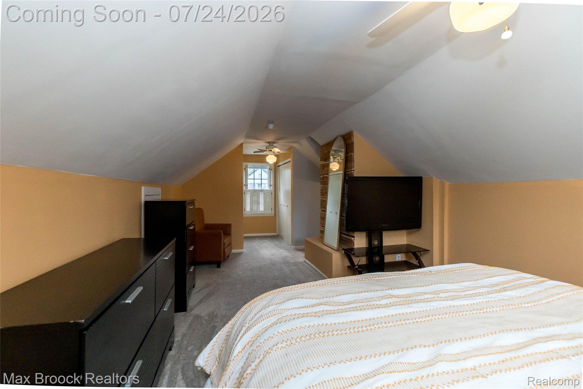 1090 Cambridge Road Berkley, MI 48072 - Photo 21 of 43 Attic space featuring sloped ceilings, light beige wall paint, and gray carpet flooring