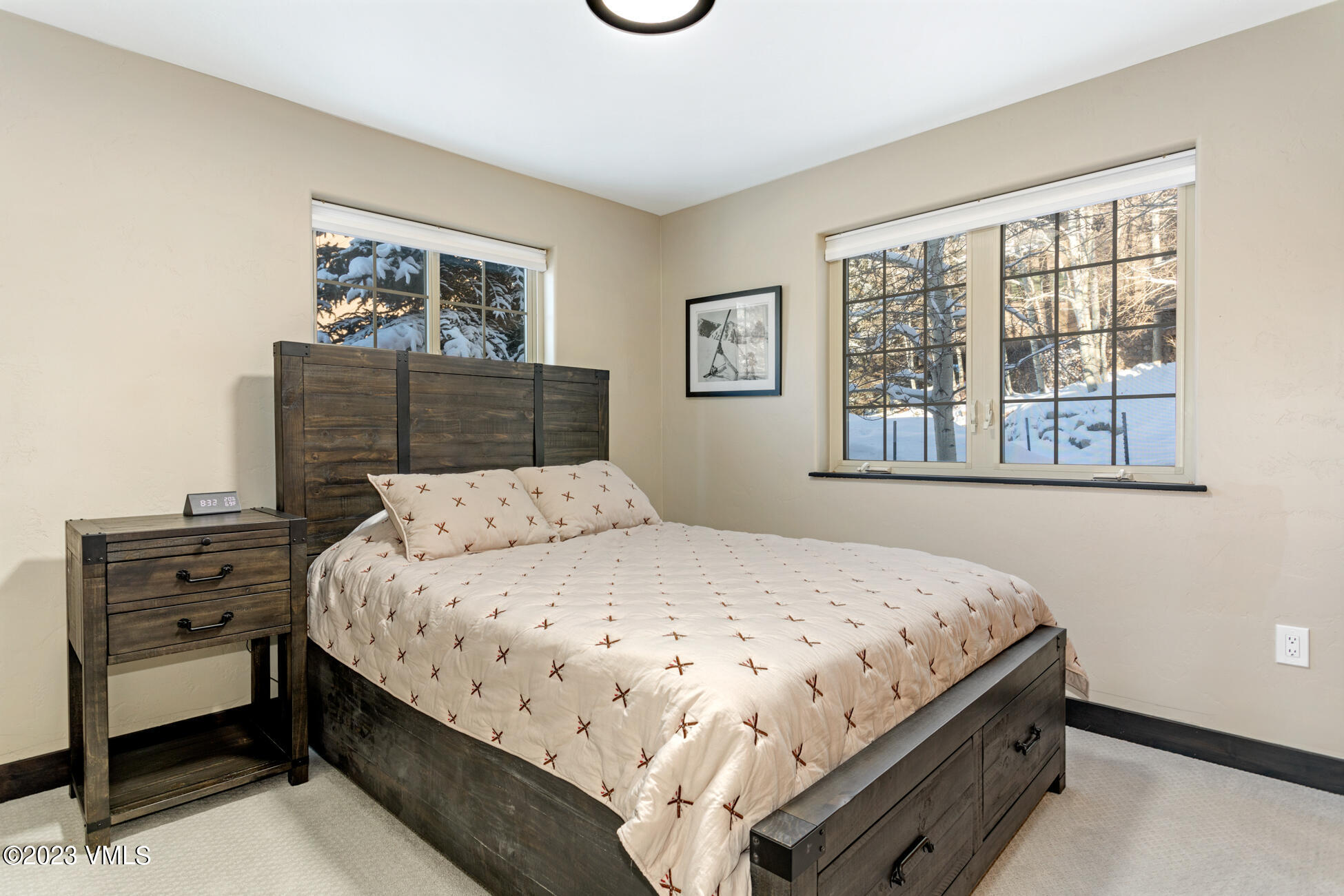 160 Nottingham Road, Unit 1 Avon, CO 81620 - Photo 11 of 28 a bedroom with a bed and a dresser next to a window