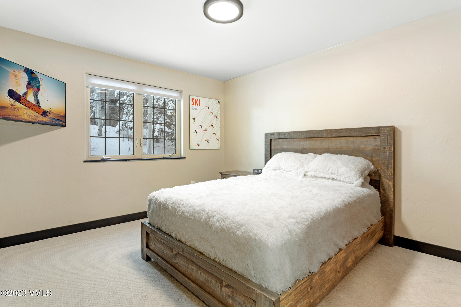 160 Nottingham Road, Unit 1 Avon, CO 81620 - Photo 14 of 28 a large bed sitting in a bedroom next to a window